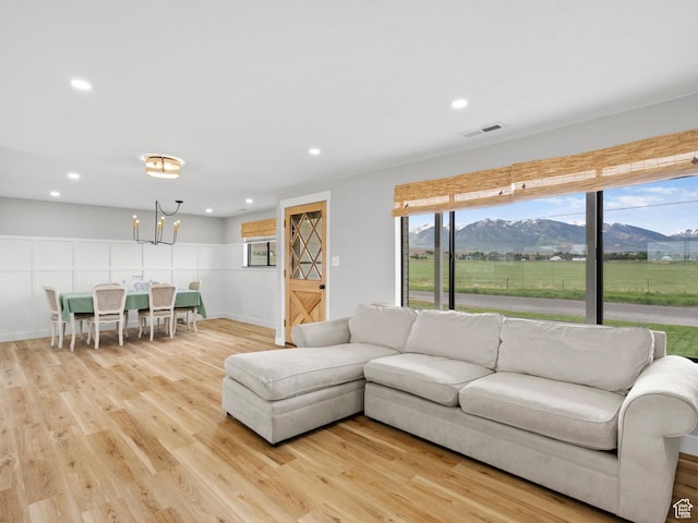 1491 Bryan Rd, Erda, UT 84074 - living room with a mountain view, light wood-type flooring, a chandelier, and recessed lighting
