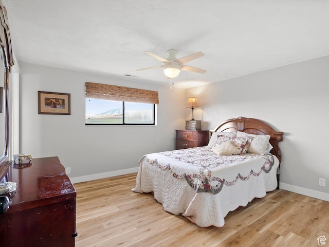1491 Bryan Rd, Erda, UT 84074 - bedroom featuring light wood finished floors, baseboards, and ceiling fan
