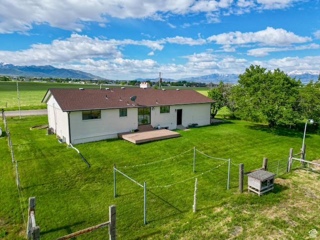 1491 Bryan Rd, Erda, UT 84074 - rear view of house featuring a deck with mountain view and stucco siding