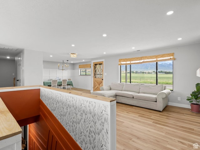 1491 Bryan Rd, Erda, UT 84074 - living area featuring light wood finished floors, recessed lighting, and baseboards