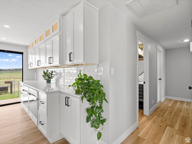 1491 Bryan Rd, Erda, UT 84074 - corridor with baseboards, light wood-style floors, and recessed lighting