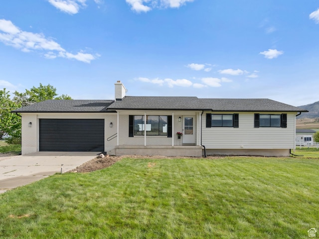 1491 Bryan Rd, Erda, UT 84074 - ranch-style house featuring an attached garage, a front lawn, driveway, a chimney, and a shingled roof