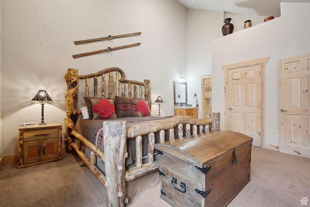 3975 Timberwolf Ln Unit 2C, Park City, UT 84098 - carpeted bedroom with a high ceiling, ensuite bath, baseboards, and a ceiling fan