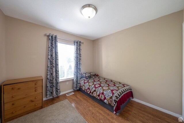 6216 S Waller Ln W, West Jordan, UT 84081 - bedroom featuring wood finished floors and baseboards
