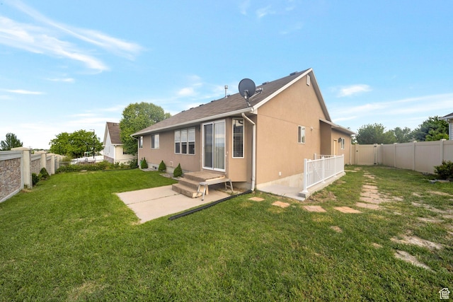 6216 S Waller Ln W, West Jordan, UT 84081 - back of property with a patio area and stucco siding