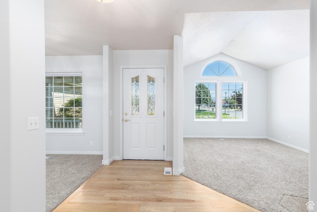 2275 W 1500 S Unit 28, Syracuse, UT 84075 - entrance foyer featuring light colored carpet, vaulted ceiling, and baseboards