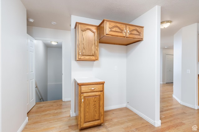 2275 W 1500 S Unit 28, Syracuse, UT 84075 - kitchen featuring light wood-type flooring, light countertops, and baseboards