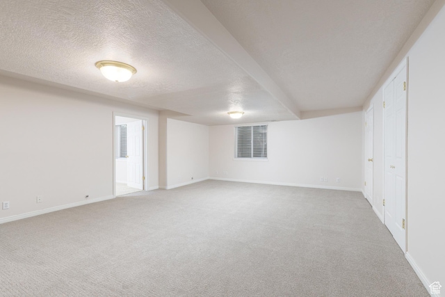 2275 W 1500 S Unit 28, Syracuse, UT 84075 - unfurnished bedroom featuring light colored carpet, a textured ceiling, and baseboards