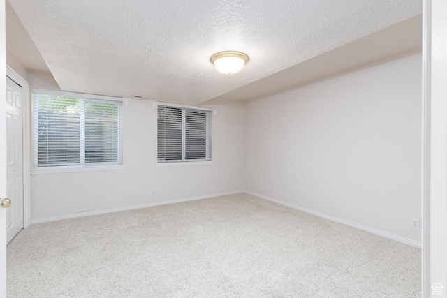 2275 W 1500 S Unit 28, Syracuse, UT 84075 - carpeted spare room with a textured ceiling and baseboards