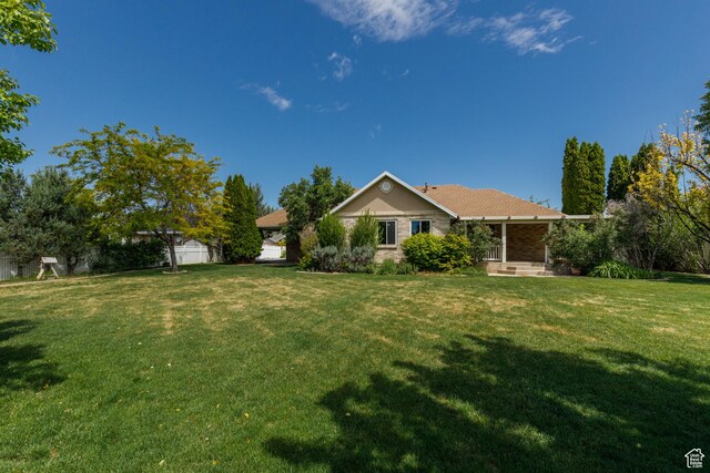 2275 W 1500 S Unit 28, Syracuse, UT 84075 - back of house with a lawn