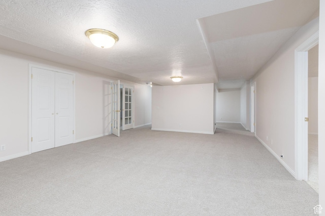 2275 W 1500 S Unit 28, Syracuse, UT 84075 - finished below grade area with light carpet, a textured ceiling, and baseboards