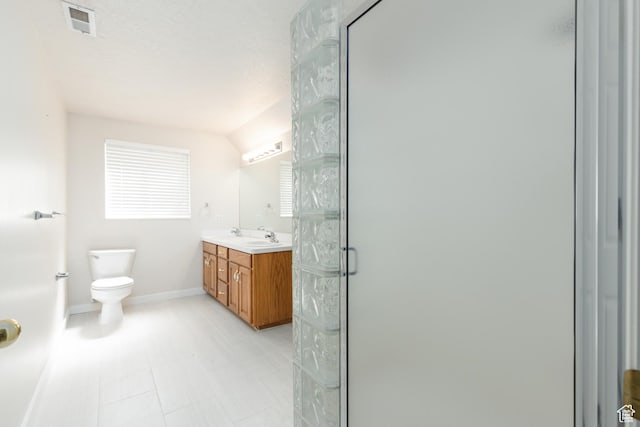 2275 W 1500 S Unit 28, Syracuse, UT 84075 - full bathroom with double vanity, a shower stall, toilet, and baseboards