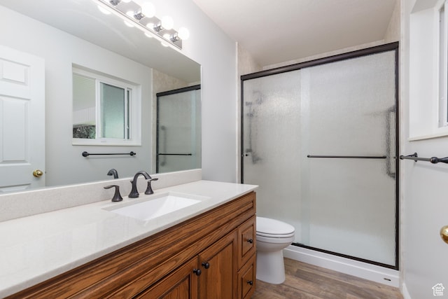 2275 W 1500 S Unit 28, Syracuse, UT 84075 - full bath with vanity, a stall shower, wood finished floors, and toilet