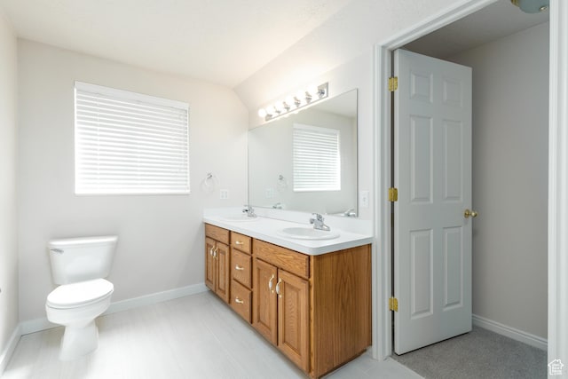 2275 W 1500 S Unit 28, Syracuse, UT 84075 - bathroom featuring double vanity, baseboards, and toilet
