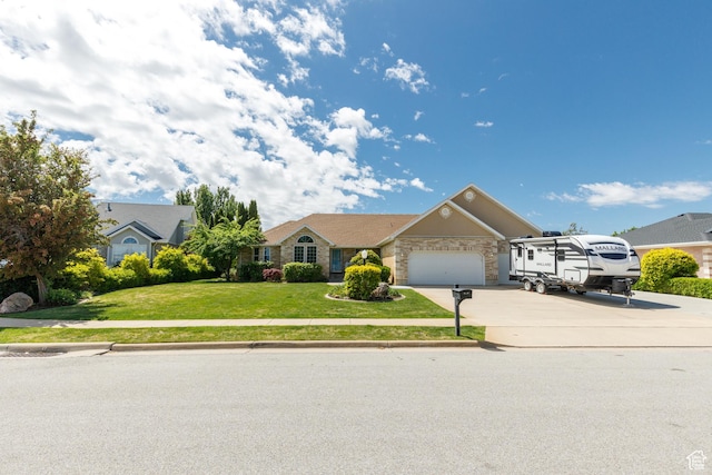 2275 W 1500 S Unit 28, Syracuse, UT 84075 - single story home with concrete driveway, an attached garage, a front yard, and stone siding