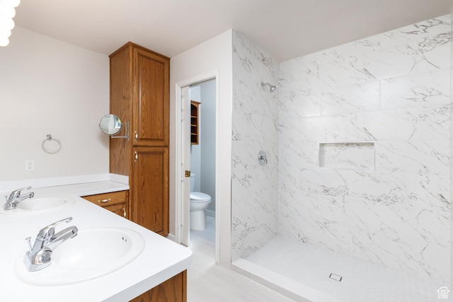 2275 W 1500 S Unit 28, Syracuse, UT 84075 - bathroom featuring toilet, double vanity, and a stall shower