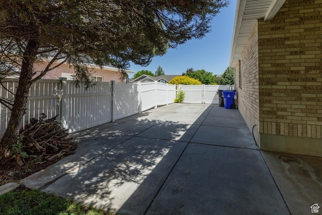 2275 W 1500 S Unit 28, Syracuse, UT 84075 - fenced backyard featuring a patio area