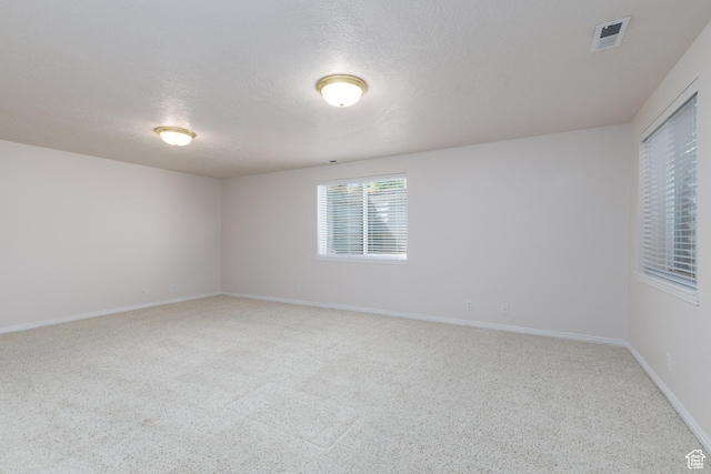 2275 W 1500 S Unit 28, Syracuse, UT 84075 - carpeted spare room featuring a textured ceiling and baseboards