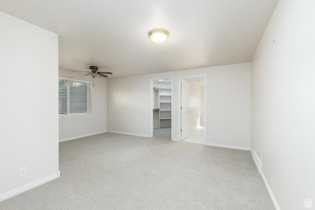 2275 W 1500 S Unit 28, Syracuse, UT 84075 - unfurnished room featuring light colored carpet, ceiling fan, and baseboards