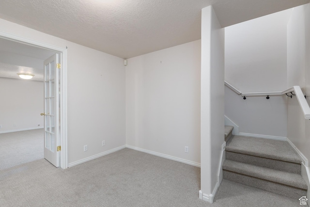2275 W 1500 S Unit 28, Syracuse, UT 84075 - staircase featuring a textured ceiling, carpet floors, and baseboards