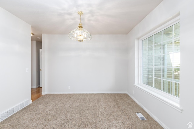 2275 W 1500 S Unit 28, Syracuse, UT 84075 - carpeted empty room featuring a chandelier and baseboards