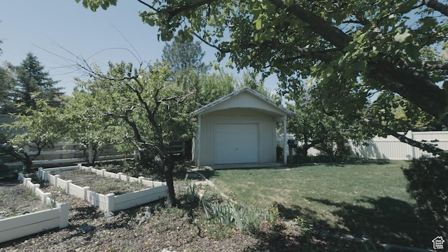 2275 W 1500 S Unit 28, Syracuse, UT 84075 - view of front of property with a vegetable garden and a detached garage