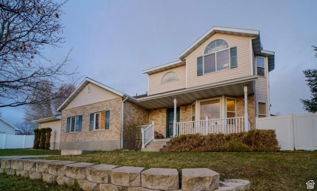 398 S 900 E, Smithfield, UT 84335 - traditional-style home with a porch and brick siding