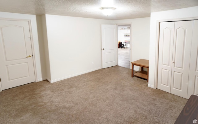 398 S 900 E, Smithfield, UT 84335 - unfurnished bedroom with carpet floors, a textured ceiling, baseboards, and a closet