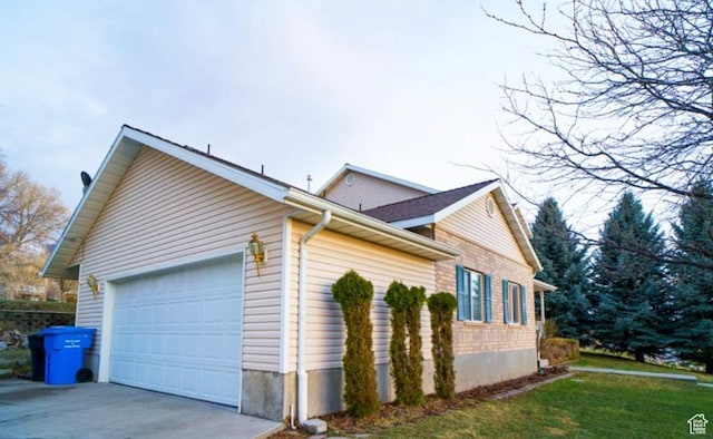 398 S 900 E, Smithfield, UT 84335 - view of home's exterior with a garage, concrete driveway, and a lawn