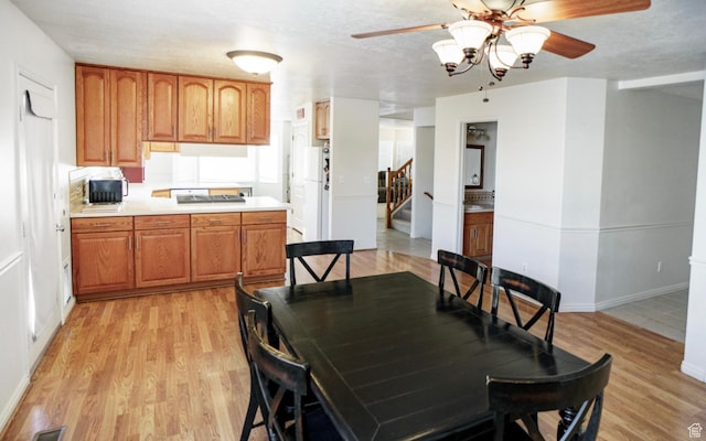 398 S 900 E, Smithfield, UT 84335 - dining space with ceiling fan, light wood-type flooring, stairway, and baseboards