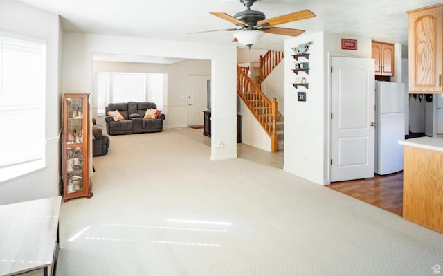 398 S 900 E, Smithfield, UT 84335 - living room featuring a ceiling fan, stairs, and carpet
