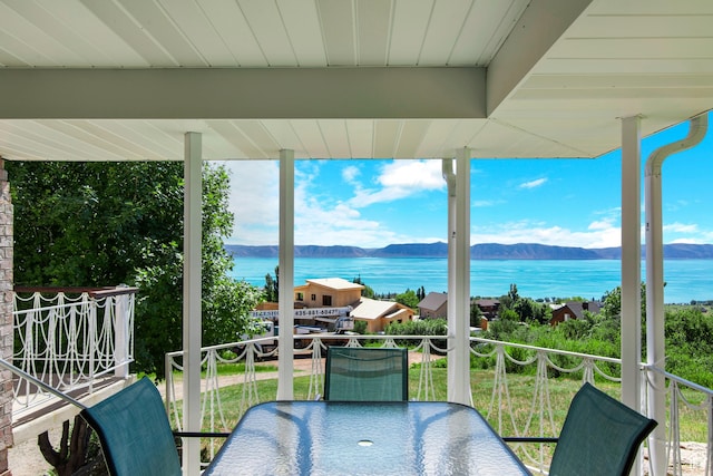 27 Lake W Cir, Fish Haven, ID 83287 - balcony featuring a water and mountain view and outdoor dining area