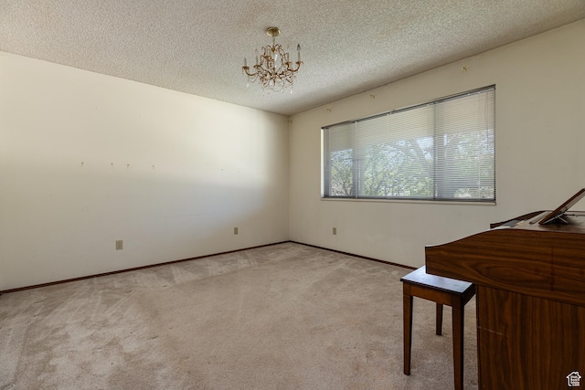 437 S 100 W, Kanab, UT 84741 - unfurnished bedroom with light carpet, a chandelier, a textured ceiling, and baseboards
