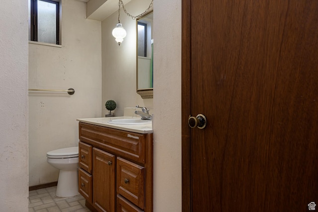 437 S 100 W, Kanab, UT 84741 - bathroom featuring brick patterned flooring, toilet, and vanity