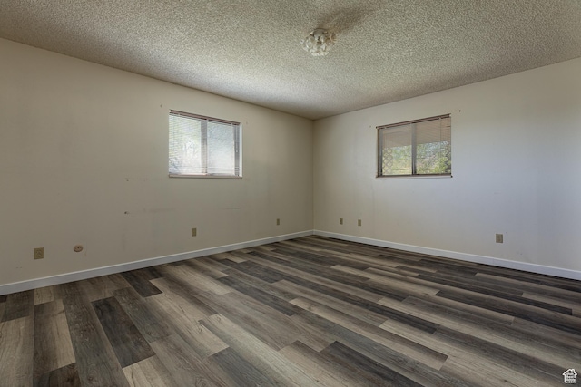 437 S 100 W, Kanab, UT 84741 - spare room with dark wood finished floors, a textured ceiling, and baseboards