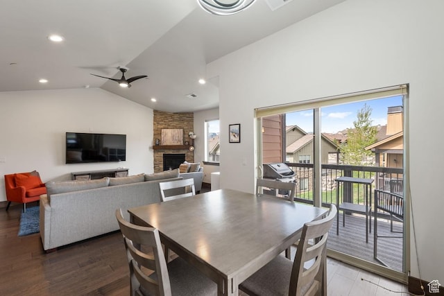 14311 N Buck Horn Trl Unit 42N, Kamas, UT 84036 - dining space featuring a stone fireplace, wood finished floors, lofted ceiling, a ceiling fan, and recessed lighting