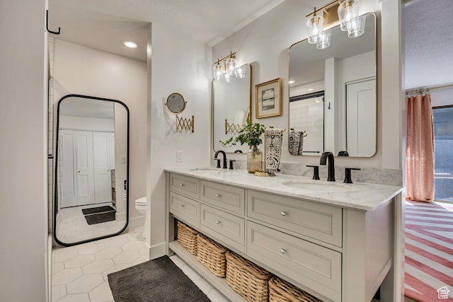 2634 S Cave Hollow Way, Bountiful, UT 84010 - full bath featuring double vanity, tile patterned floors, toilet, and a shower with door