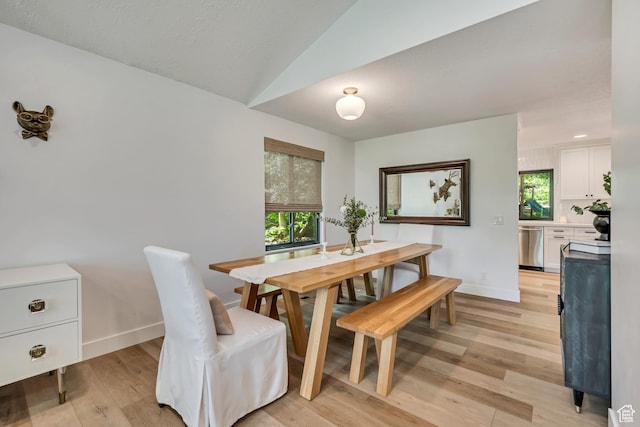 2634 S Cave Hollow Way, Bountiful, UT 84010 - dining space featuring light wood-type flooring, plenty of natural light, baseboards, and vaulted ceiling