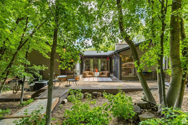 2634 S Cave Hollow Way, Bountiful, UT 84010 - back of house with outdoor lounge area, a wooden deck, central AC unit, and a chimney