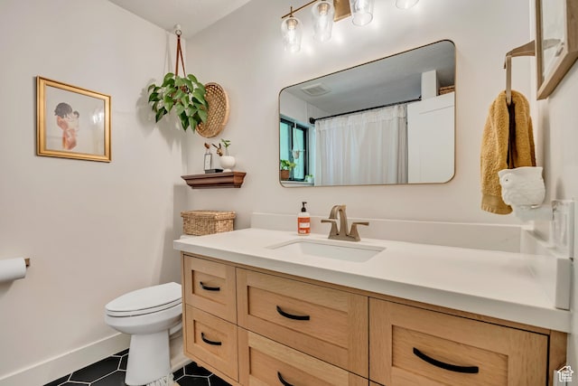 2634 S Cave Hollow Way, Bountiful, UT 84010 - bathroom featuring toilet, vanity, tile patterned floors, and baseboards