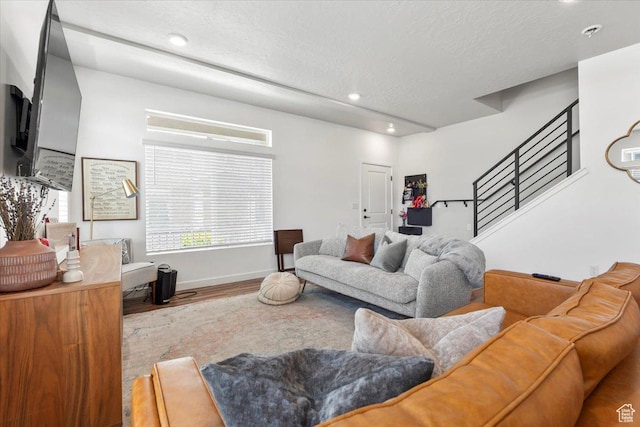 4376 W Bromwell Ct, Lehi, UT 84043 - living room with wood finished floors, stairway, recessed lighting, a textured ceiling, and baseboards
