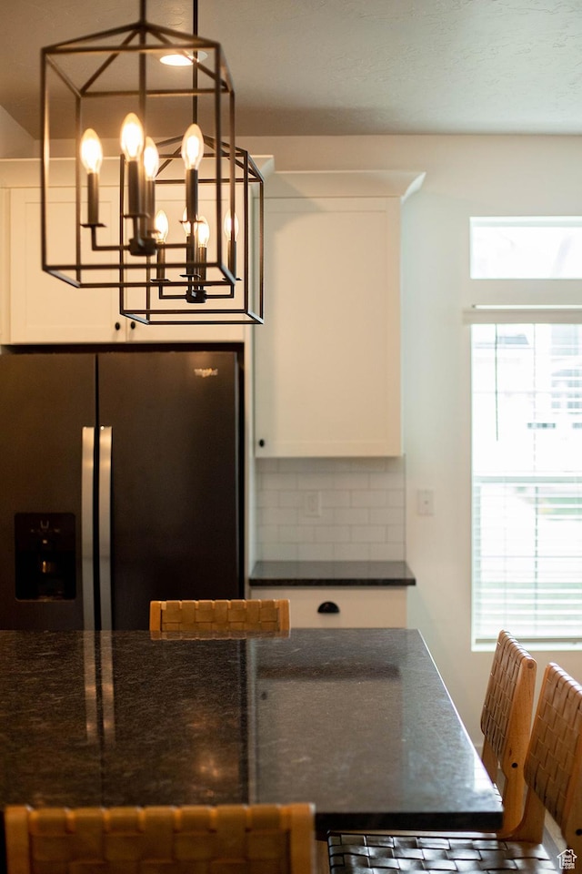4376 W Bromwell Ct, Lehi, UT 84043 - kitchen featuring stainless steel refrigerator with ice dispenser, dark countertops, decorative backsplash, and plenty of natural light