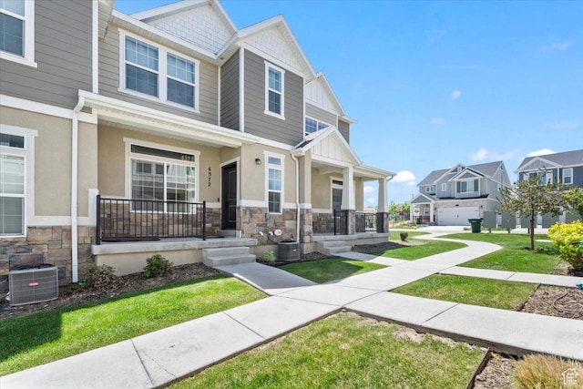 4376 W Bromwell Ct, Lehi, UT 84043 - view of front facade with covered porch, stone siding, cooling unit, and a residential view