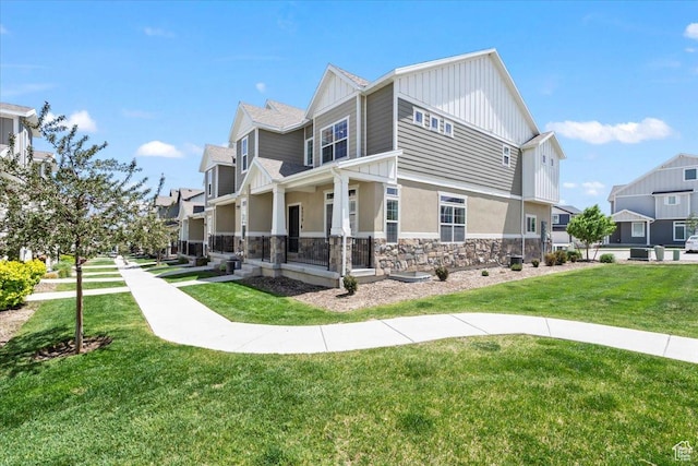 4376 W Bromwell Ct, Lehi, UT 84043 - view of home's exterior featuring stone siding, a residential view, a lawn, board and batten siding, and stucco siding