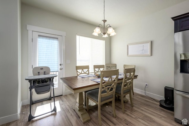2068 N 3830 W, Lehi, UT 84043 - dining space featuring a chandelier, light wood-style floors, and baseboards