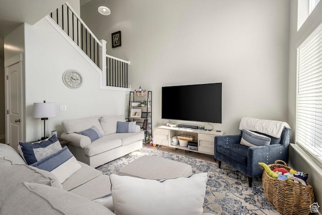 2068 N 3830 W, Lehi, UT 84043 - living room featuring plenty of natural light, a towering ceiling, wood finished floors, and stairway