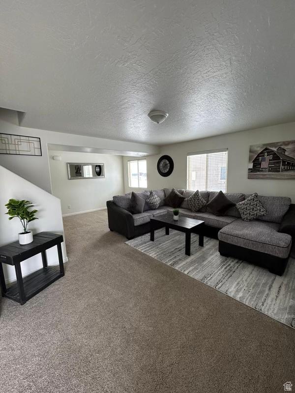 672 N 100 W, Vernal, UT 84078 - living area featuring carpet floors and a textured ceiling