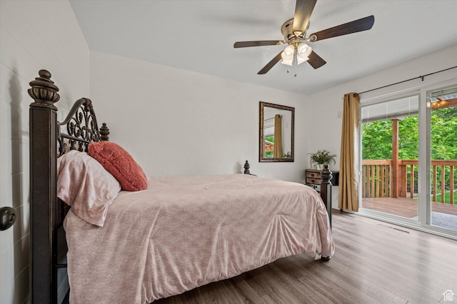 430 W 550 N, Logan, UT 84321 - bedroom with access to exterior, wood finished floors, multiple windows, and a ceiling fan