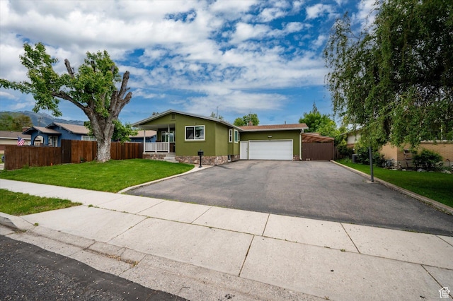 430 W 550 N, Logan, UT 84321 - ranch-style house with a garage and asphalt driveway
