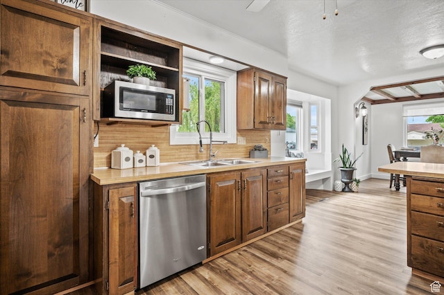 430 W 550 N, Logan, UT 84321 - kitchen with appliances with stainless steel finishes, a sink, tasteful backsplash, and light countertops